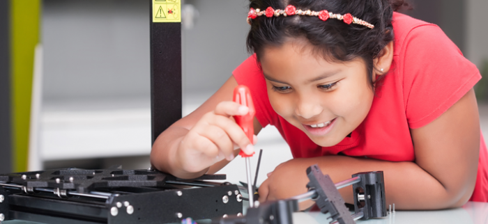 Photo of a young girl working on a STEM-related project.